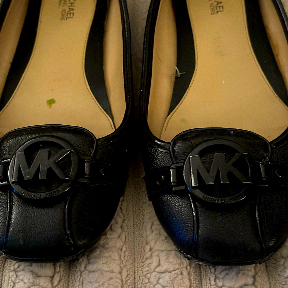 MK black leather flats